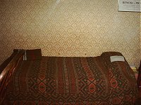 A bed. I love the old wallpaper. Nostalgia.