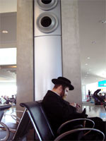 A hassidic Jew using a Blackberry.