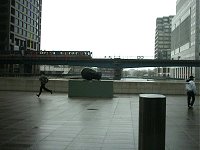 A man running in the rain. And a fallen head.