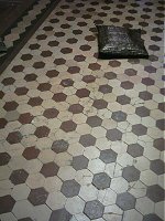 Cracked tiles were hidden for years by carpet.