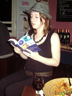 Ms Bee reads the book at a launch party.