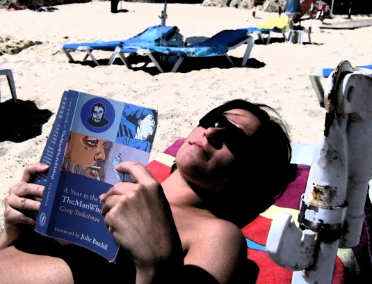 An arty pic of Marcela reading on the beach. 